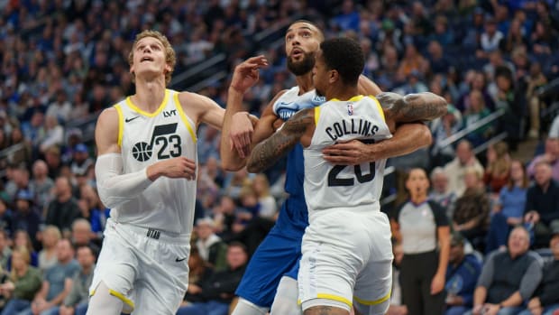 Nov 4, 2023; Minneapolis, Minnesota, USA; Minnesota Timberwolves center Rudy Gobert (27) is defended by Utah Jazz forward John Collins (20) and forward Lauri Markkanen (23) in the first quarter at Target Center. Mandatory Credit: Matt Blewett-USA TODAY Sports
